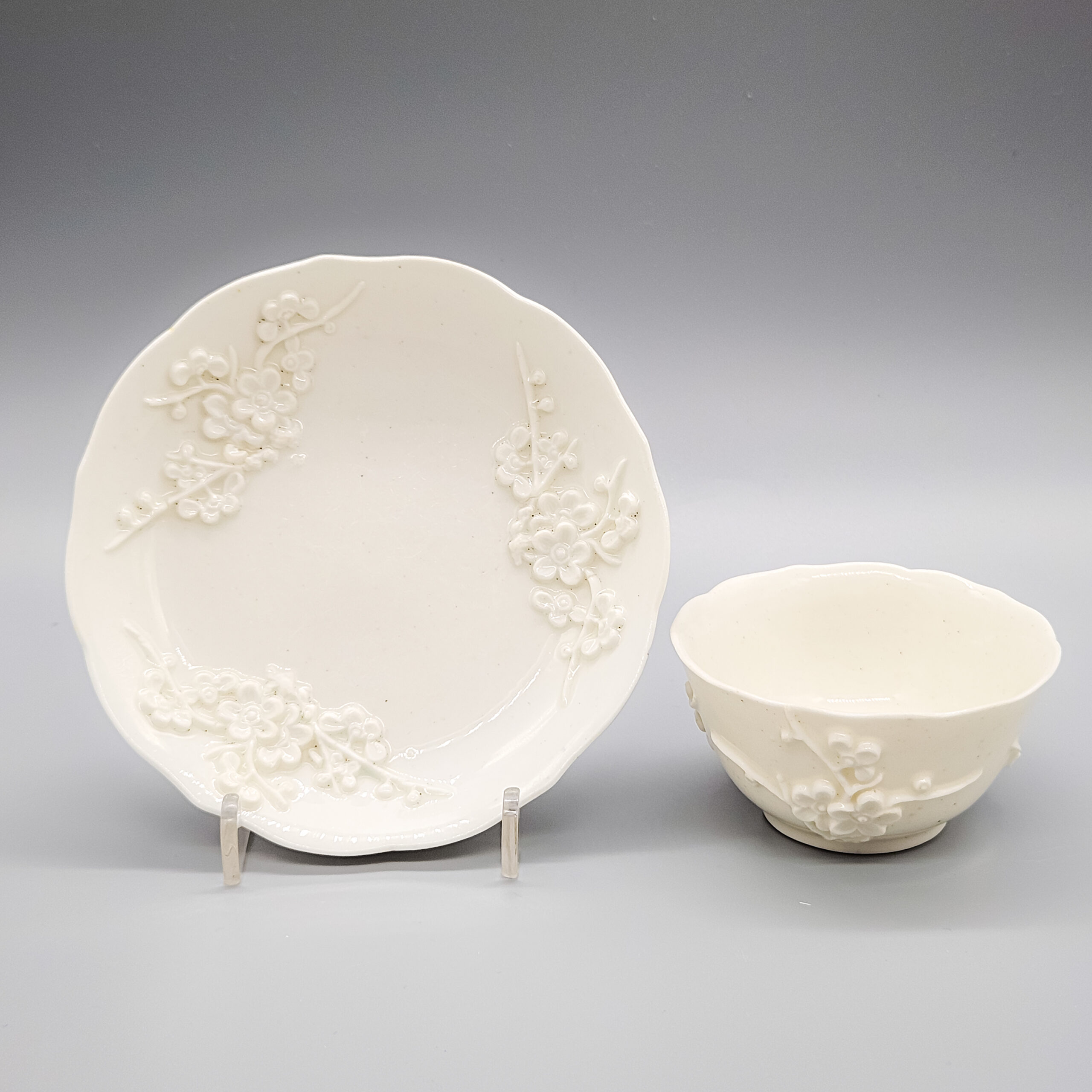 A Bow white porcelain tea bowl and saucer, circa 1752