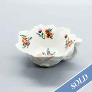 A rare polychrome Worcester butterboat, circa 1755