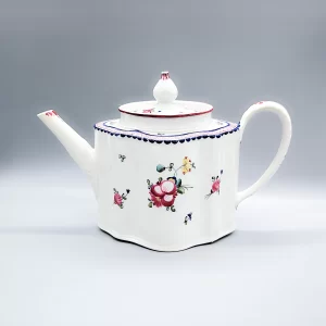 A rare New Hall flower-footed teapot and cover with feather moulded handle, circa 1785
