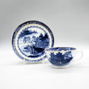 An unusual New Hall hardpaste low teacup and saucer, circa 1787-90