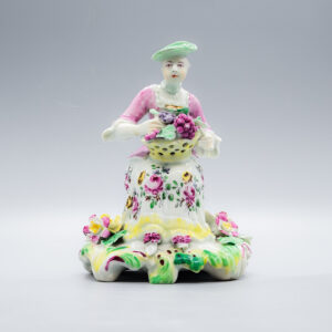 A rare Derby 'pale family' figure of Autumn, about 1758-60
